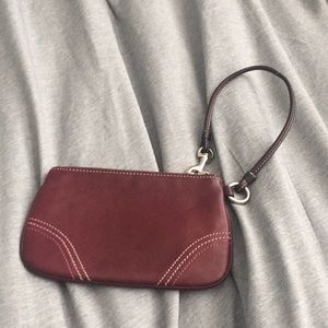 Small plum Coach wristlet